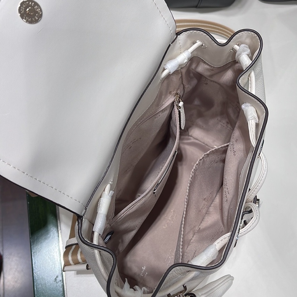 Kate Spade Rosie Medium Flap Backpack 
K8714 pebbled leather Parchment rosie
NWT - Picture 5 of 16